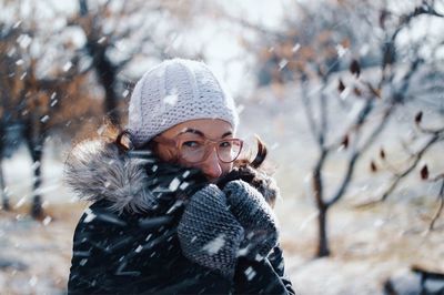 Portrait of a smiling woman in snow