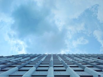 Low angle view of building against cloudy sky