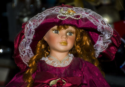 Close-up portrait of girl wearing hat