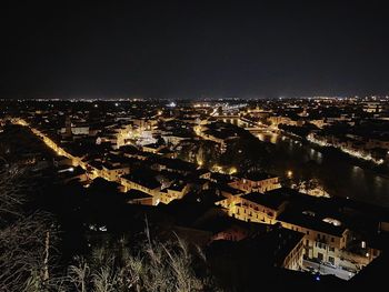 High angle view of illuminated buildings in city at night