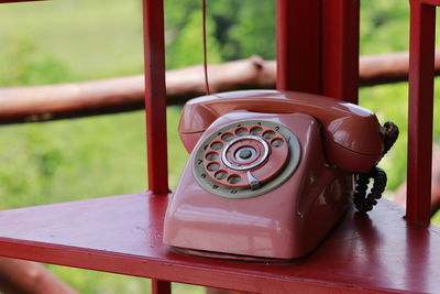 Close-up of telephone on table