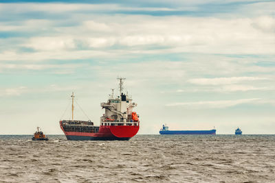 Nautical vessel on beach against sky