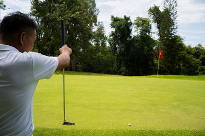 Man playing golf