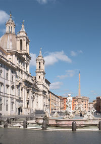 View of buildings in city against sky