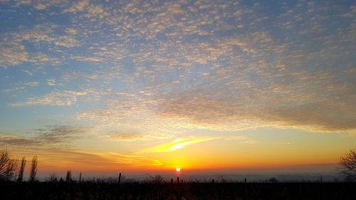 Scenic view of silhouette landscape against sky during sunset