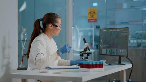 Businesswoman working at laboratory