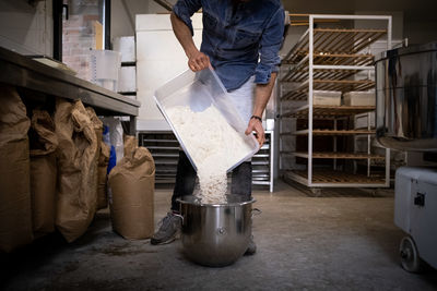 Rear view of man working in workshop