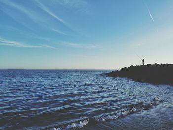 View of calm sea against blue sky