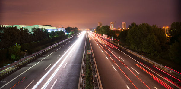 High angle view of light trails on road
