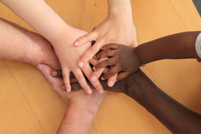 High angle view of couple hands