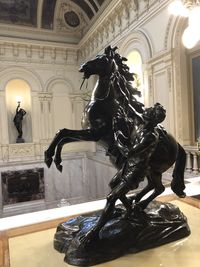 Statue in illuminated building