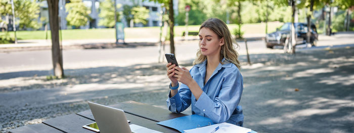 Young woman using mobile phone