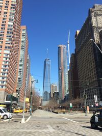 Road leading towards city skyline