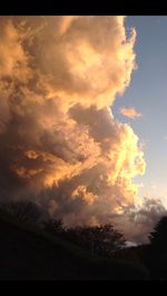 Scenic view of landscape against cloudy sky