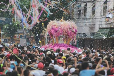 Crowd on tree in city