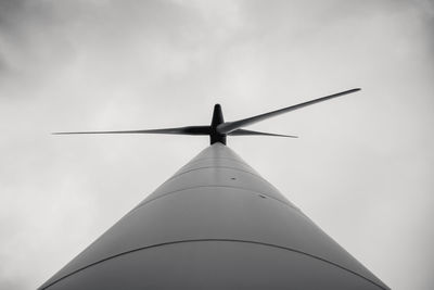 Low angle view of windmill against sky