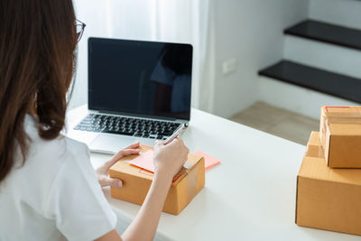 High angle view of woman using mobile phone