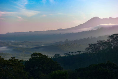 Scenic view of mountains against sky during sunset