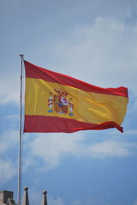 Low angle view of flag against sky