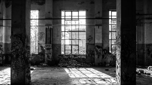 Damaged window in abandoned building