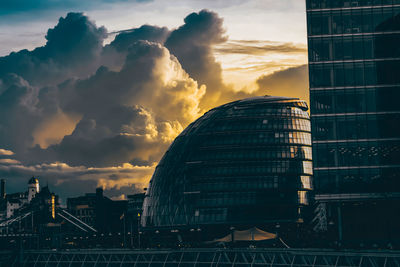 Low angle view of buildings against sky during sunset