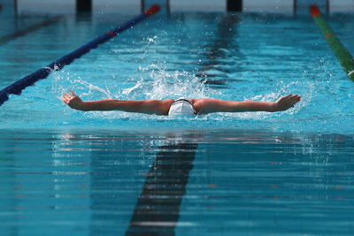 Swimmer swimming in pool