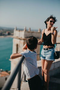 Smiling women and boy on the castle