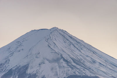 Snow covered mountain against clear sky