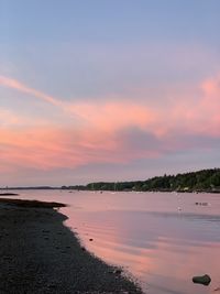 Scenic view of sea against sky at sunset