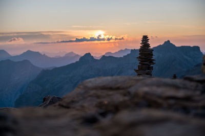 Scenic view of rocky mountains against sky during sunset