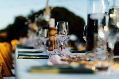 Luxury table settings for fine dining with and glassware, beautiful blurred background. 