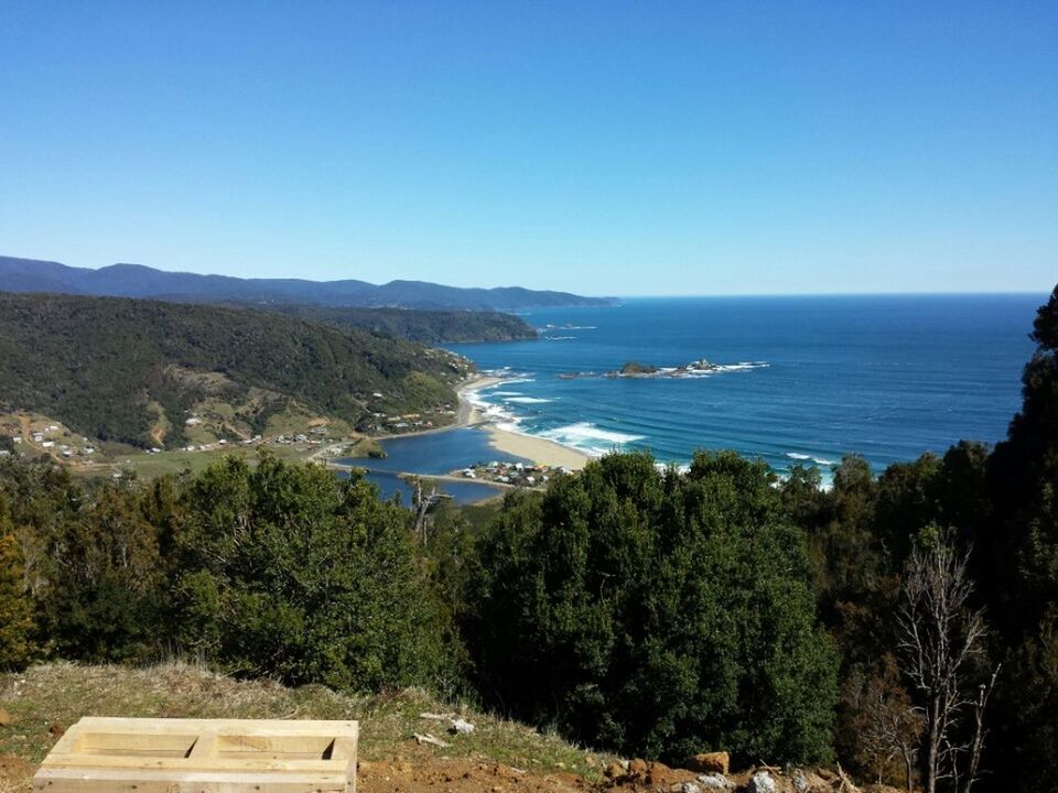 clear sky, sea, water, copy space, blue, scenics, tranquil scene, horizon over water, tree, tranquility, mountain, beauty in nature, high angle view, nature, coastline, idyllic, landscape, beach, day, outdoors