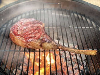 High angle view of meat on barbecue grill