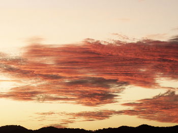 Low angle view of dramatic sky during sunset