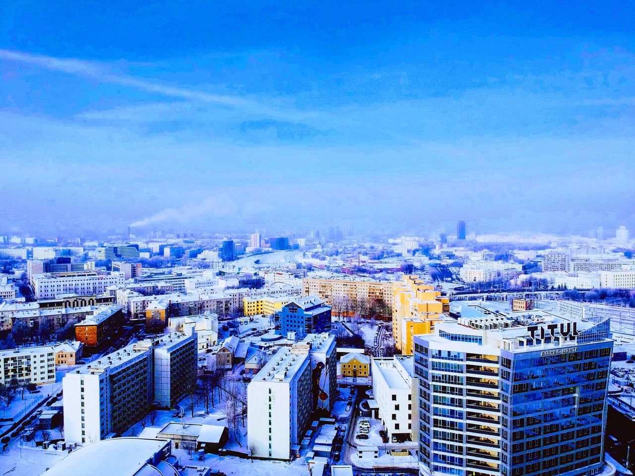 HIGH ANGLE VIEW OF BUILDINGS AGAINST SKY