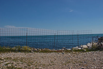 Scenic view of sea against clear blue sky