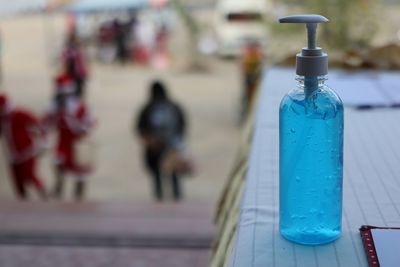 Close-up of glass bottle on table