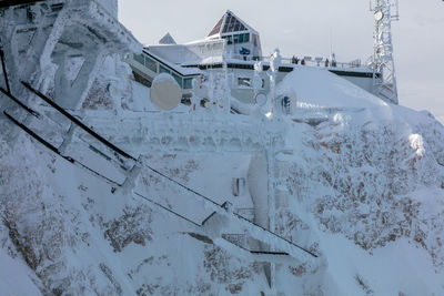 Low angle view of snow covered built structure