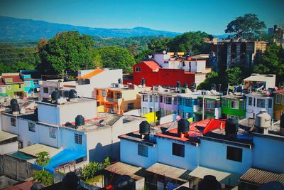 Houses against blue sky and clouds