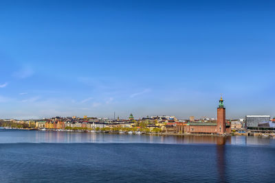 View of embankment wityh city hall of stockholm from the sodermalm island, sweden