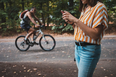 Man riding bicycle on road