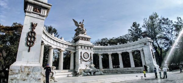 Low angle view of statue against sky