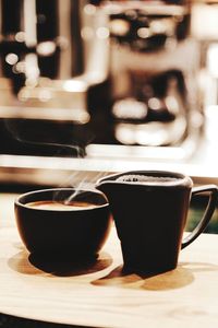 Close-up of coffee cup on table