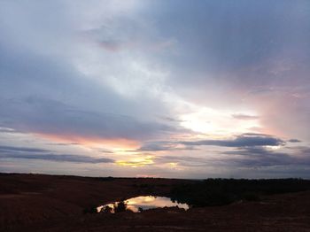 Scenic view of sunset over land