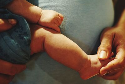 Midsection of person carrying baby