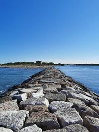 Scenic view of sea against clear blue sky