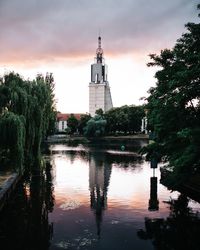 Reflection of building and trees on water