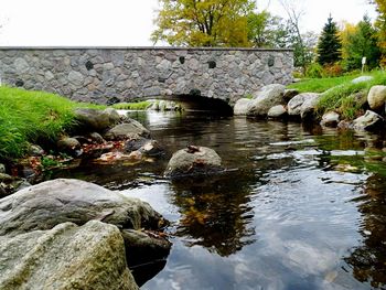 Reflection of rocks in pond