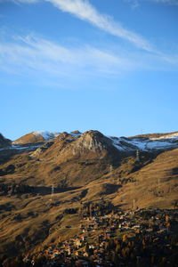 Low angle view of rock formations against sky