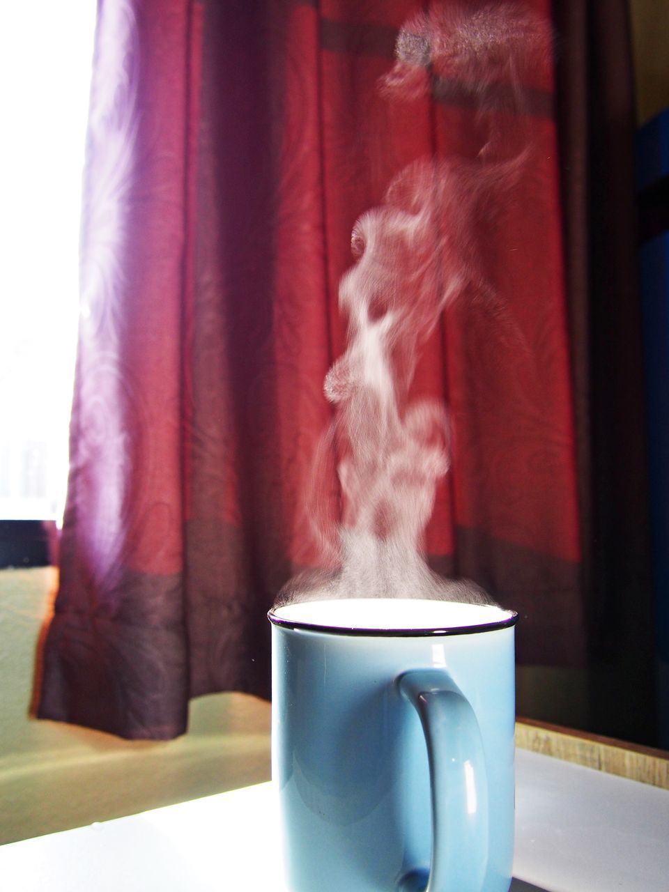 CLOSE-UP OF TEA CUP ON TABLE